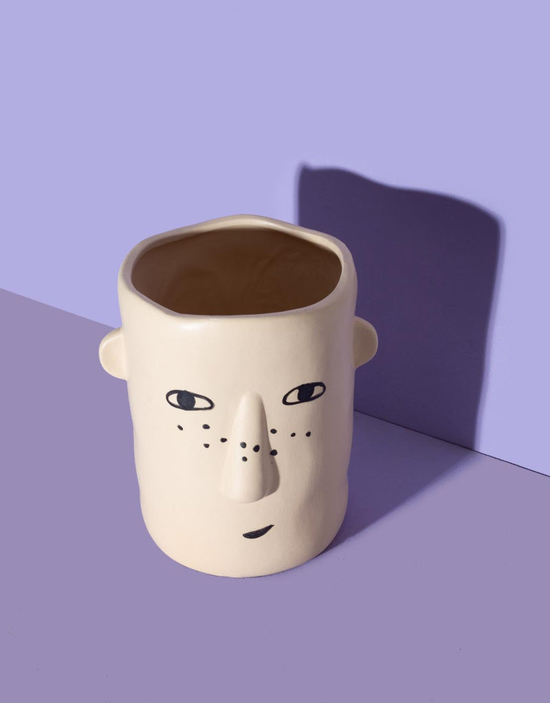 Ceramic vase with face print