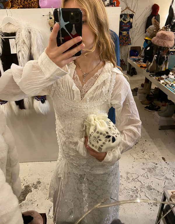 Free people Handcrafted sequin polti bag with pom-poms
