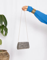 Handcrafted elongated stud shoulder bag