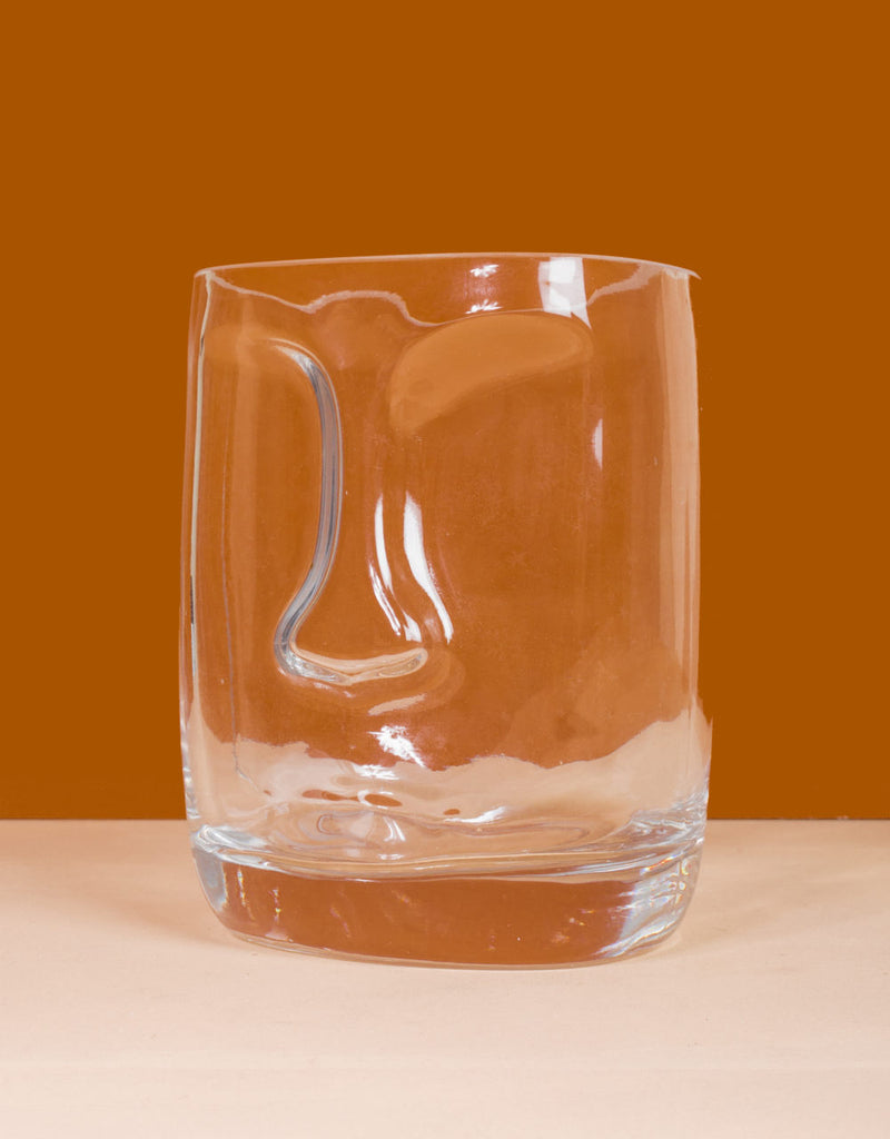 transparent vase with face